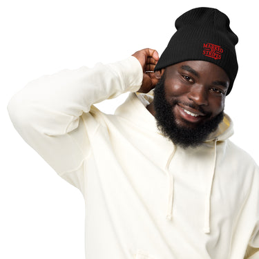 Man wearing black Christian beanie – bold red Marked by Stripes embroidery on cuff